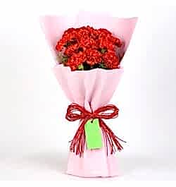 Send 12 Red Carnations Bouquet In Pink Paper to Bangladesh